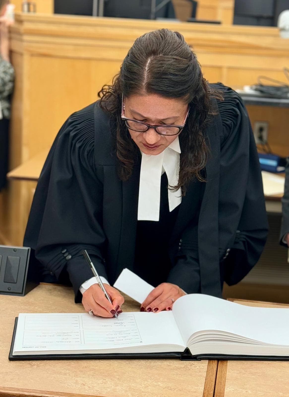 Lawyer in consultation with a client — Karkee Law, mission and client-focused service, Toronto
